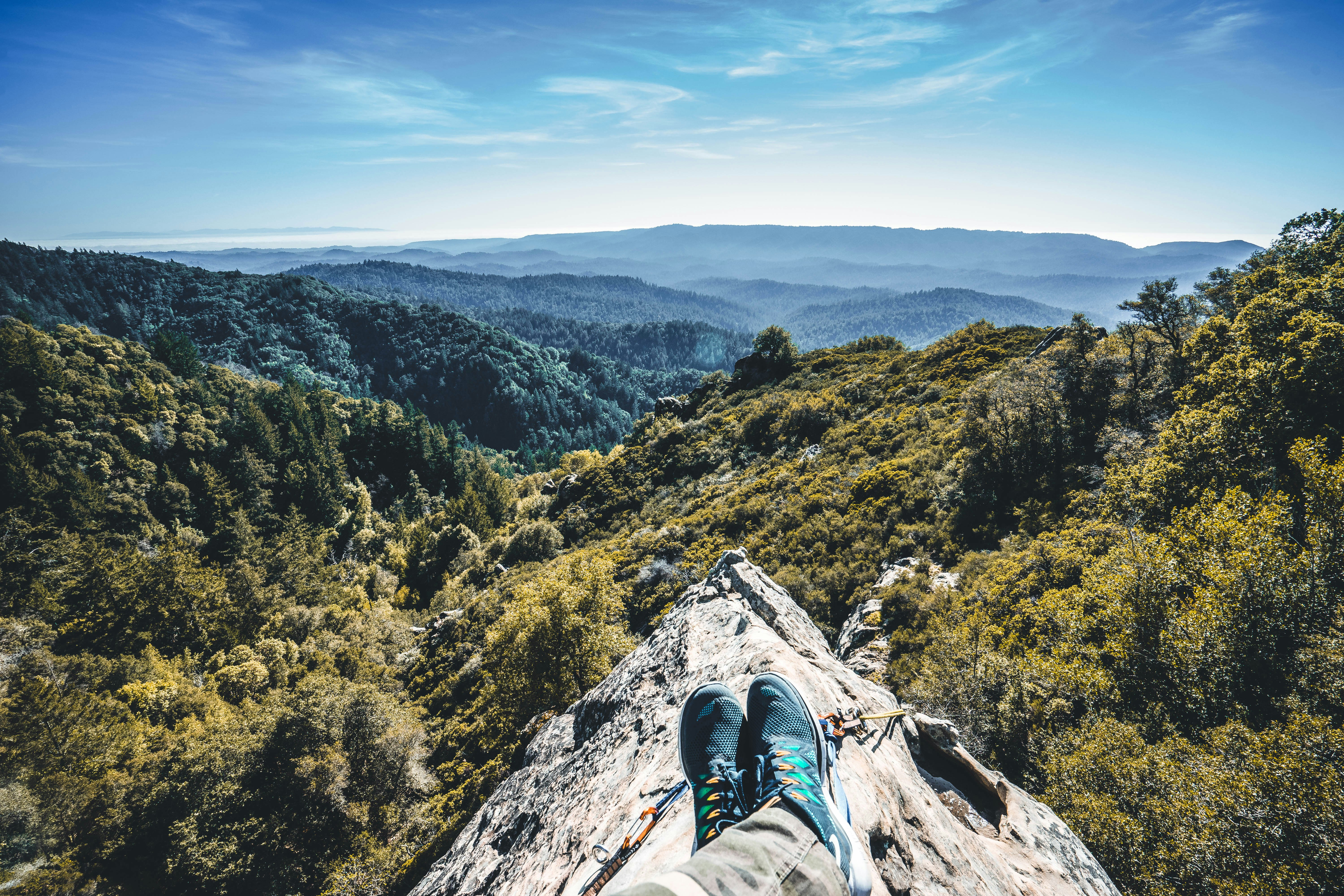 person sitting on cliff